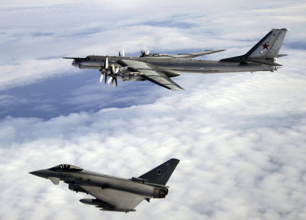 A Quick Reaction Alert (QRA) Typhoon F2 from Number XI Squadron at RAF Coningsby is pictured escorting a Russian Bear-H aircraft over the North Atlantic Ocean. QRA procedures entail aircraft being held at continuous ground readiness, so that they can take off within minutes - without pre-warning - to provide air defence.